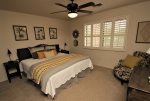 Guest bedroom off of the game room offers a king bed